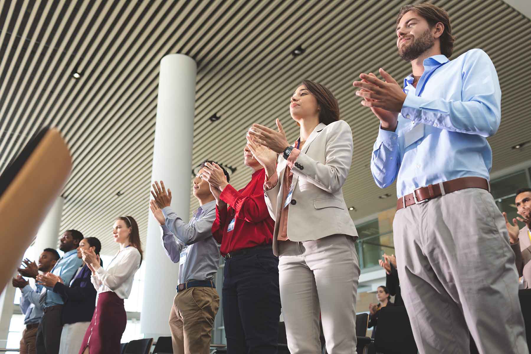 business-people-clapping-while-standing-at-a-busin-T3UJP8H.jpg